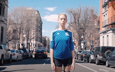 A woman who lost her leg in the Boston Marathon bombing, on video standing in Boston.