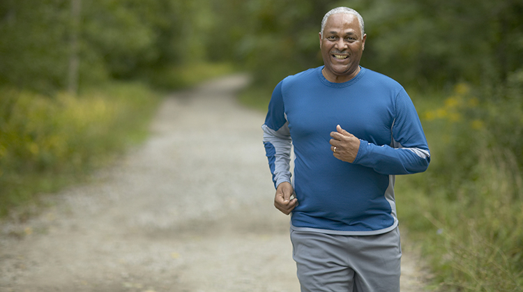 Adult man outside jogging