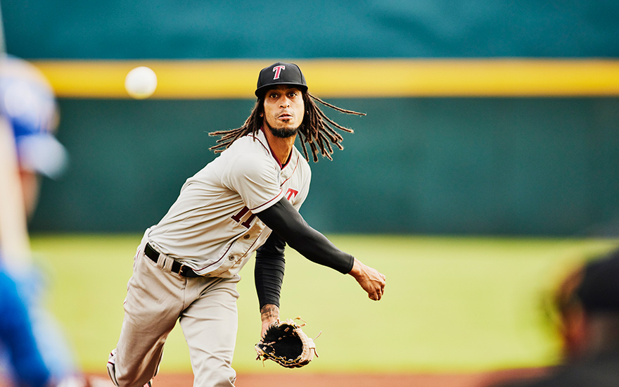 A baseball pitcher throwing a pitch