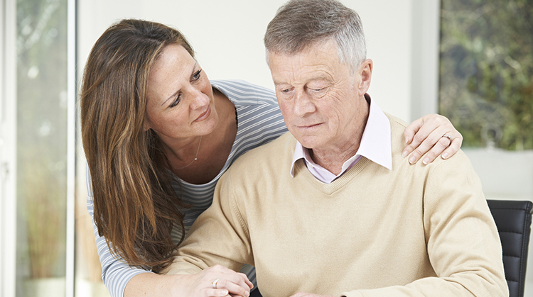 A confused man with his caregiver.
