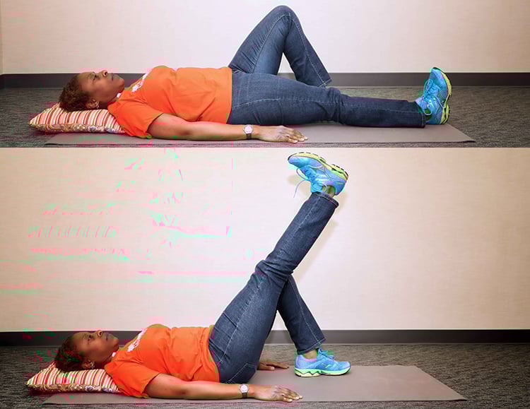 A physical therapist shows how to do a straight leg raise exercise.