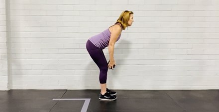 A physical therapist demonstrats strengthening exercises safe for older adults who walk without assistance.