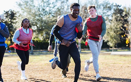 Group of  people playing flag football