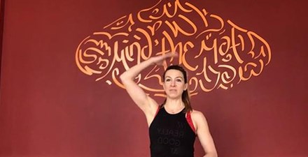 A physical therapist leads a floor/mat exercise program.