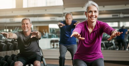 Older adults doing lower body strengthing exercises.