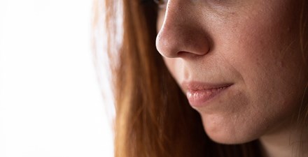 A young woman looking down.