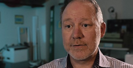 A patient on video describing physical therapy helped his pain.