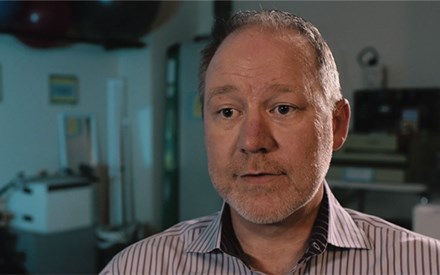 A patient on video describing physical therapy helped his pain.