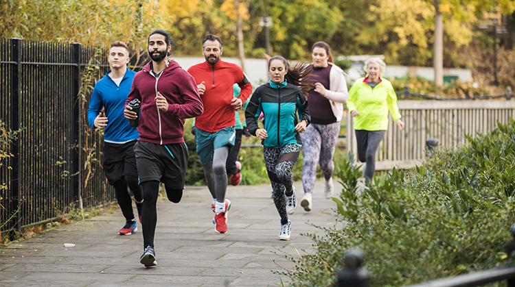 A group of people running outdoors.
