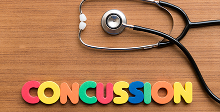 The word concussion spelled out in colored letters.