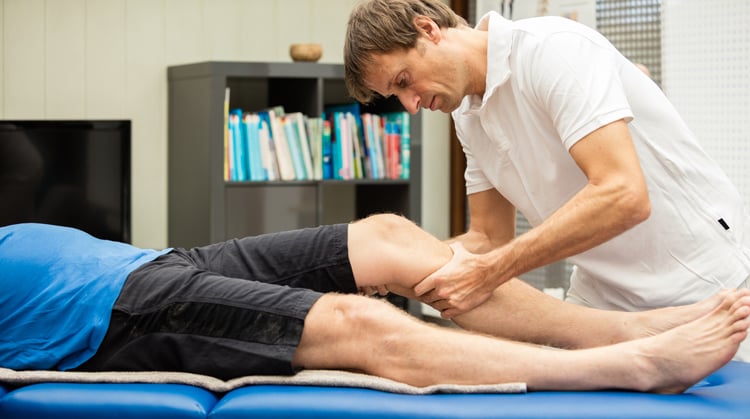 Physical therapy for compartment syndrome A physical therapist provides hands-on treatment on a patient's leg.
